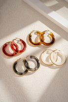 Boho Studio round marbled resin hoop earrings set with gold-tone rims